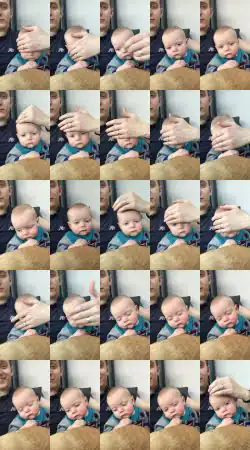 Dad Puts Baby to Sleep by Sliding Hand on Face - 1021454