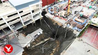 Massive sinkhole swallows Bangkok street as residents flee in panic