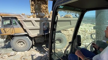 Cat 390D Excavator Loading Blasted Rocks On Cat 775E Dumper & Trucks - Pyramis Ate