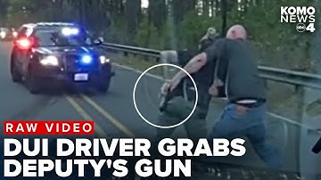 RAW VIDEO: Thurston County deputy fights with DUI suspect who grabbed her gun at crash scene