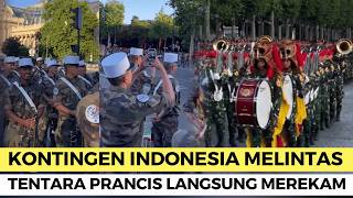 FRENCH SOLDIERS ARE ENRICHED TO RECORD THE STUNNING ACTION OF THE TNI CONTINGENT APPEARING ON THE...