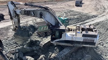 Caterpillar 375 Excavator Loads 4-Axle Trucks Non-Stop At Massive Coal Mining Site