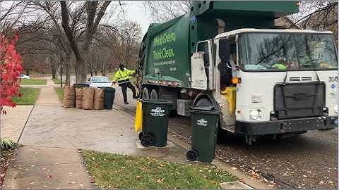 Waste Management Compost Truck With Thrower in Action Collecting Leaf Bags-Rear Loader Garbage Truck