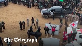 Hamas parades Israeli hostage's coffins on stage before Red Cross handover