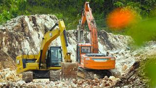 Excavator Dump Trucks Excavating Limestone Road Through The Hills