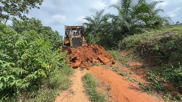 Road Maintenance in the Oil Palm Plantation, Bulldozer D6R XL Works Well
