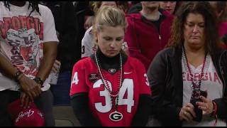 A moment of silence is held at the Sugar Bowl for New Orleans victims