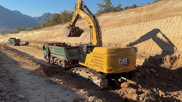Brand New Cat 352 Digger Working On A Road Construction Project With Fleet Of Trucks - Interkat SA