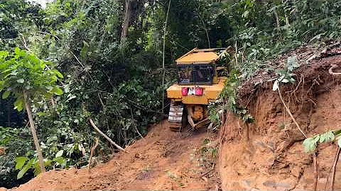The Process of Building a Mountain Road Using a CAT D6R XL Bulldozer in Dangerous Terrain